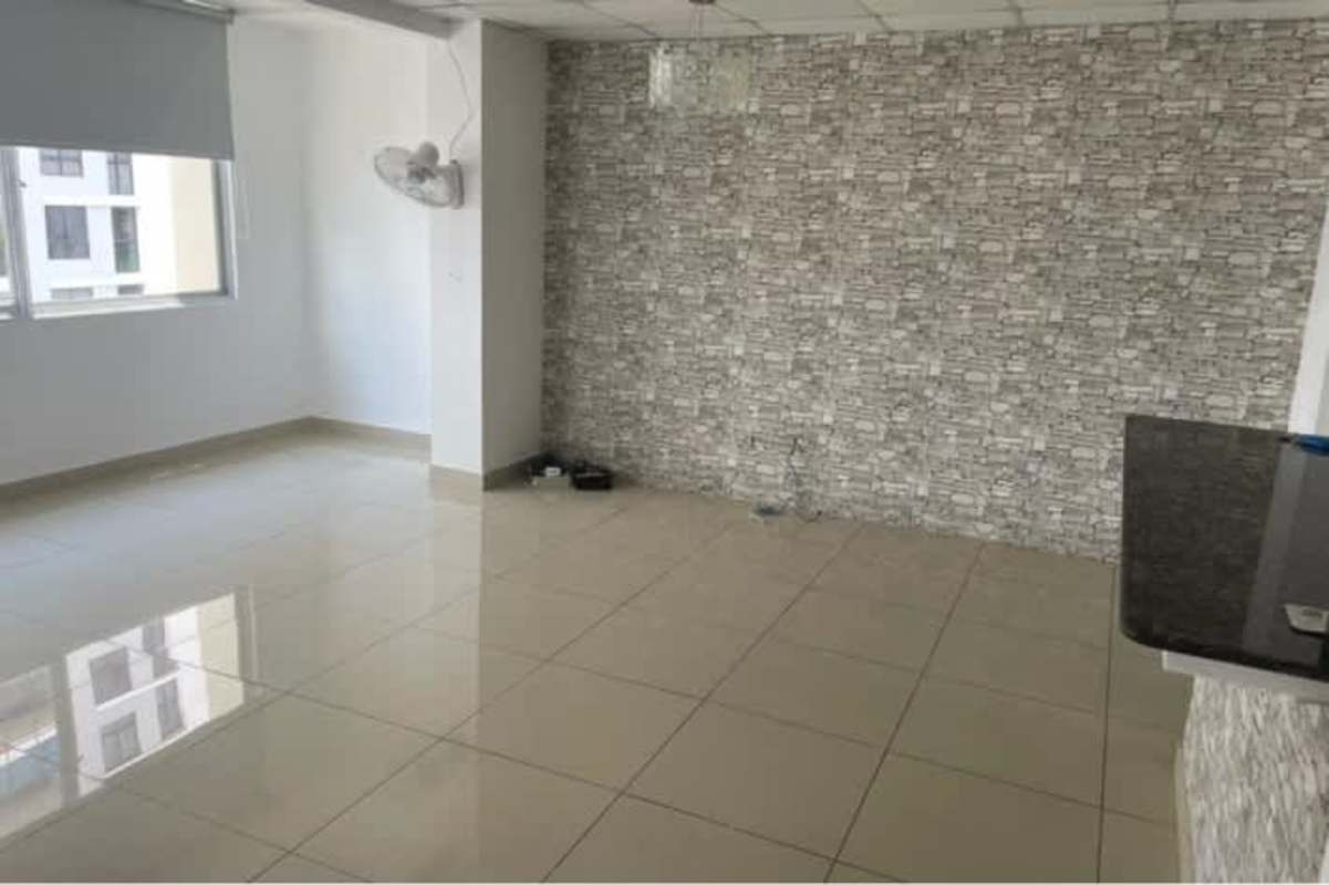 Living room with accent stone feature wall Condado Country Club Panama