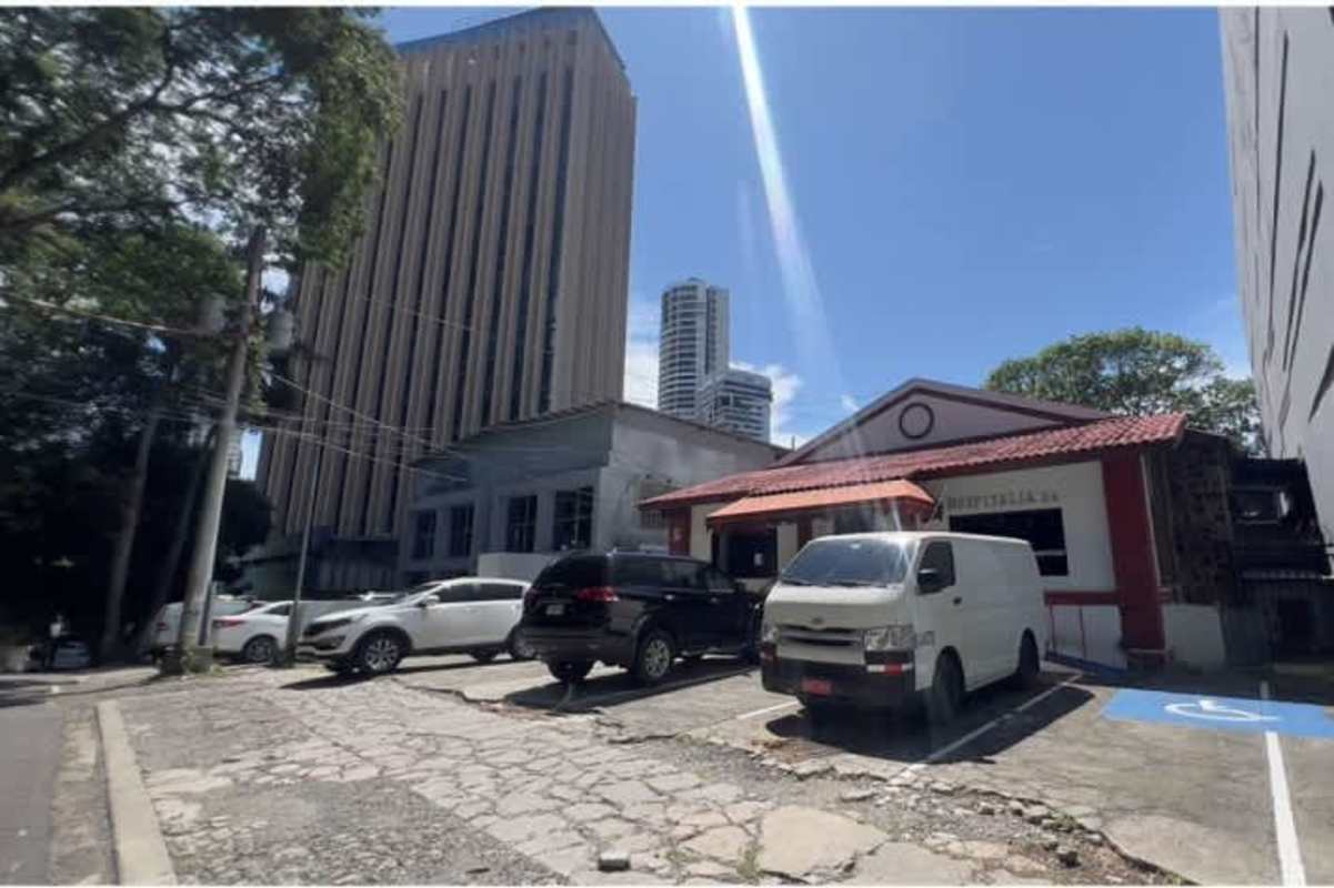 Cubicle workspace with fluorescent lighting and file cabinets business property Bella Vista Panama