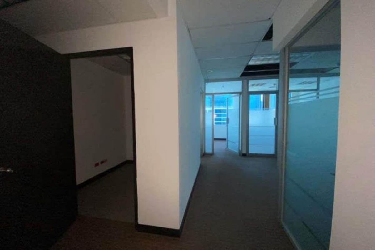 Office cubicles with glass walls inside Plaza Credicorp Bank tower Obarrio Panama