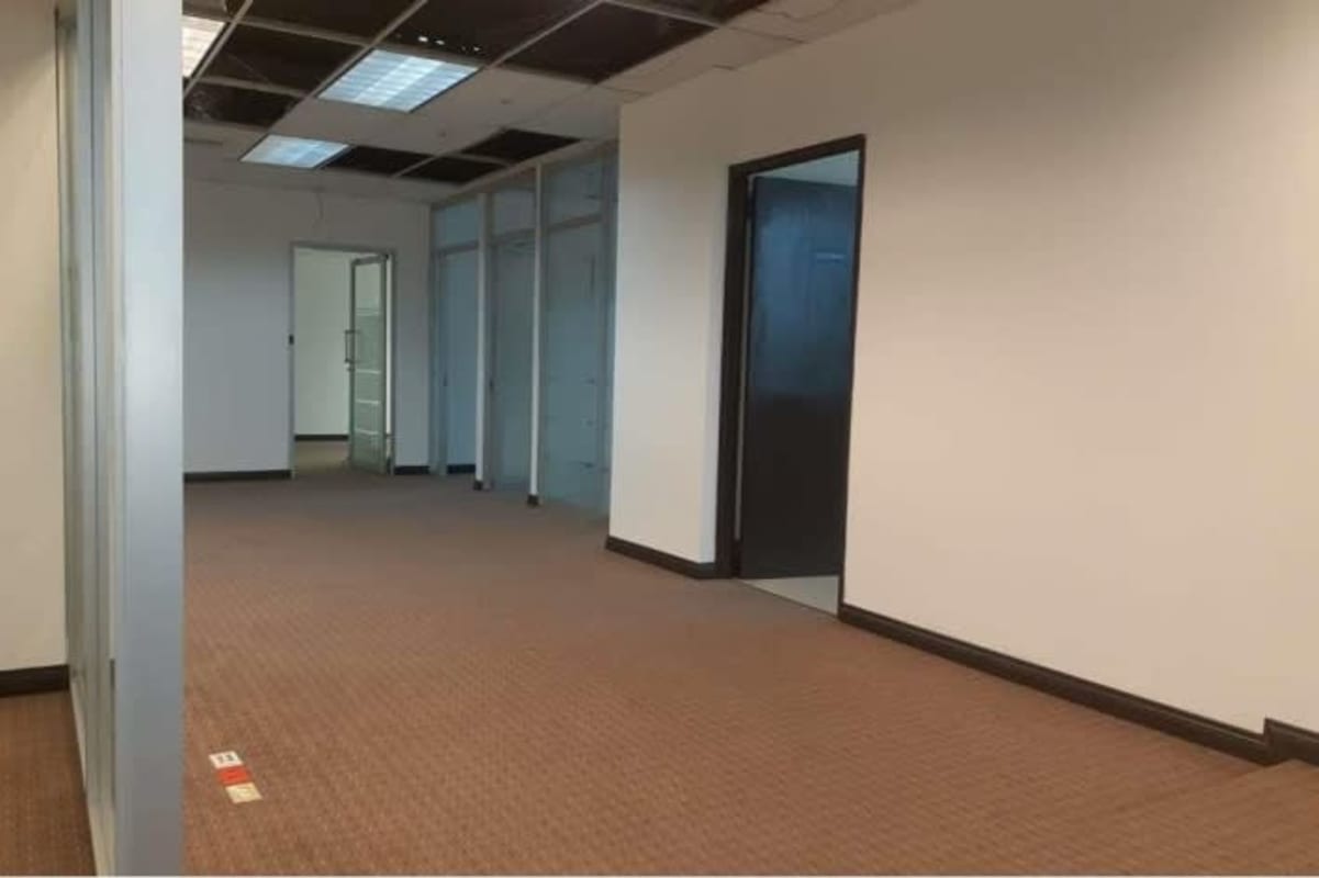 Well-lit office corridor with glass walls inside PH Plaza Credicorp Bank Obarrio Panama