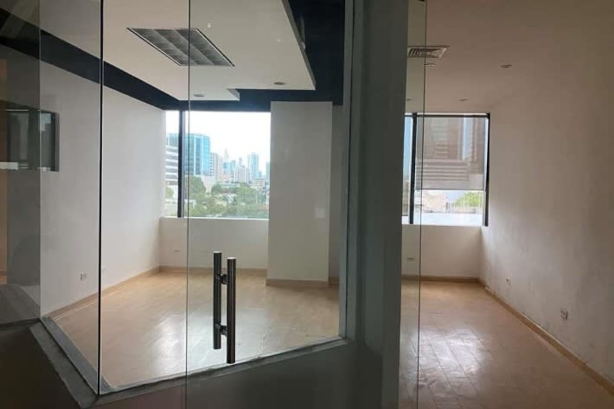 Empty commercial real estate office with glass wall partitions large windows Obarrio Panama City