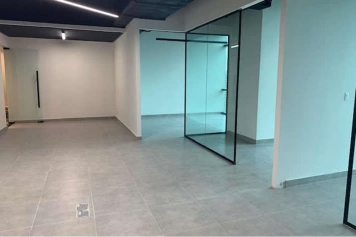 Modern office with glass-walled meeting space at PH Tower Bank Calle 50 Panama City
