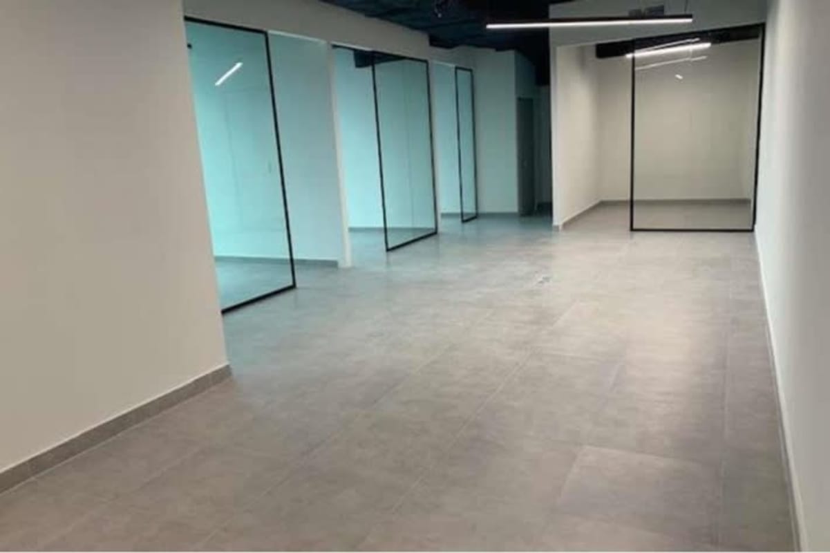 Bright office interior with glass partitions in corporate Tower Bank Calle 50 Panama City