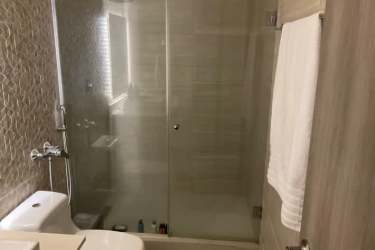 Bathroom with glass enclosed shower and modern fixtures Woodlands Panama Pacifico