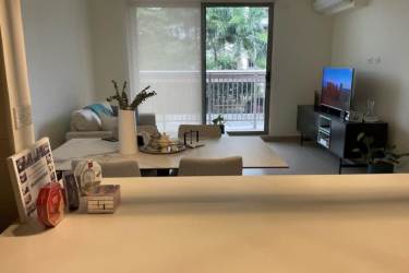 Contemporary living and dining space opening to balcony in Woodlands Panama Pacifico