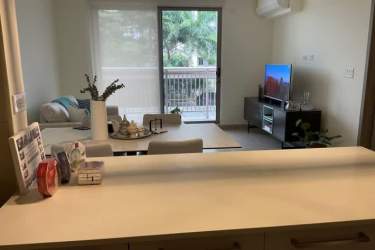 Bright living area with balcony access furnished apartment PH Woodlands Panama Pacifico