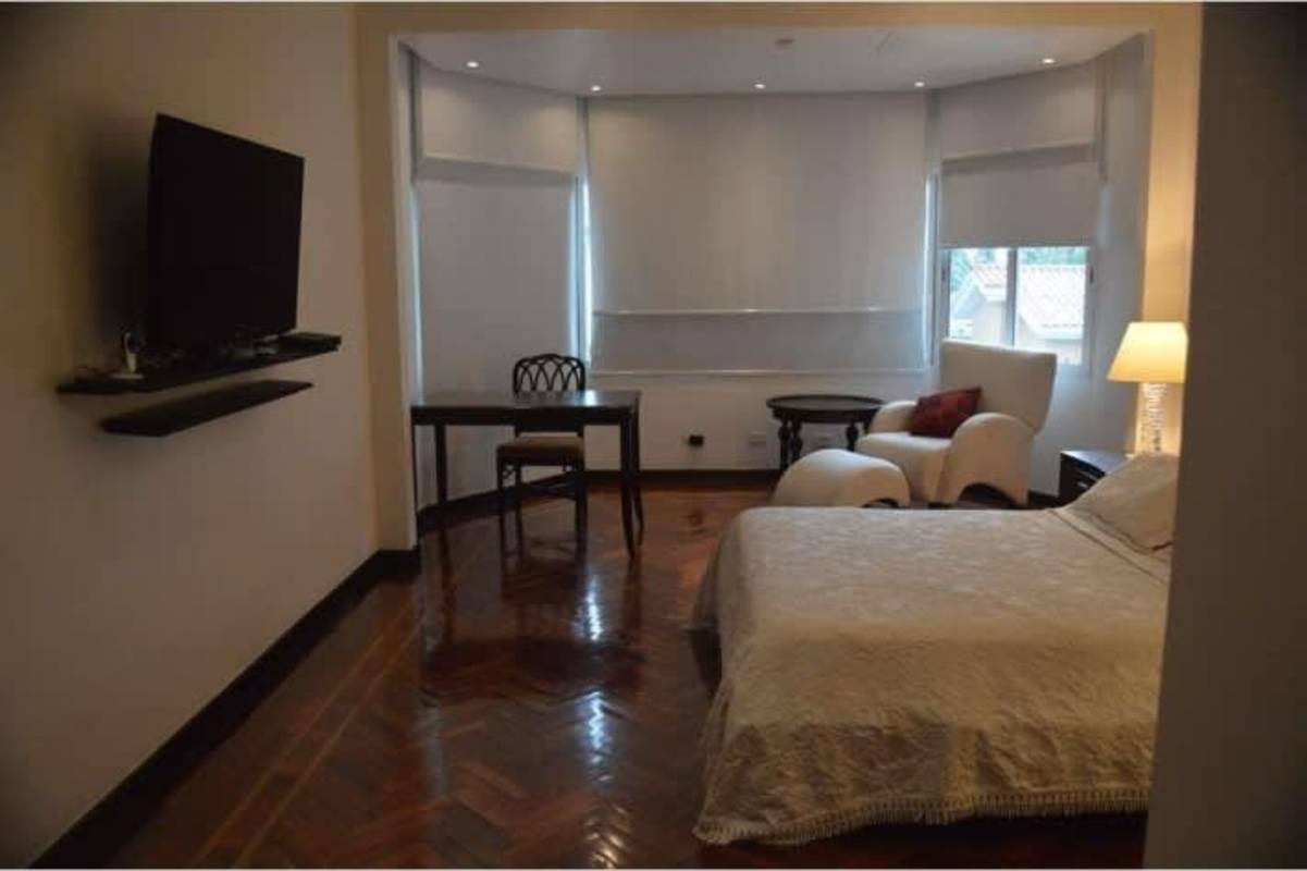 Formal dining room with panoramic wine cellar in luxury mansion La Loma Panama