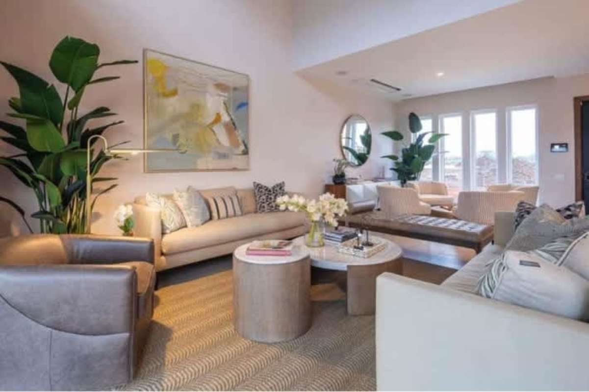 Spacious modern living room with double height ceiling, large windows in luxury house The Woods Santa Maria Panama City