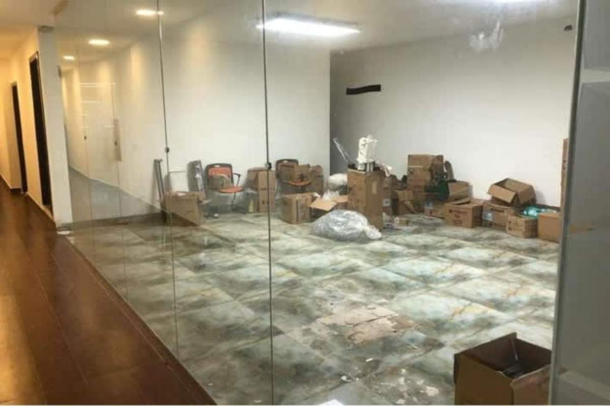 Storage room with glass partition, chairs, boxes and tiled floor Parque Industrial Costa del Este Panama