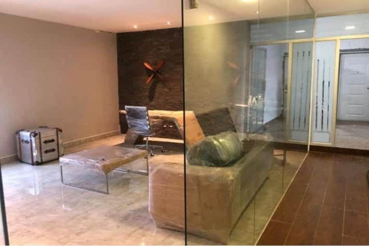 Workspace open plan area with glass walls, marble and wood floor in Parque Industrial Costa del Este