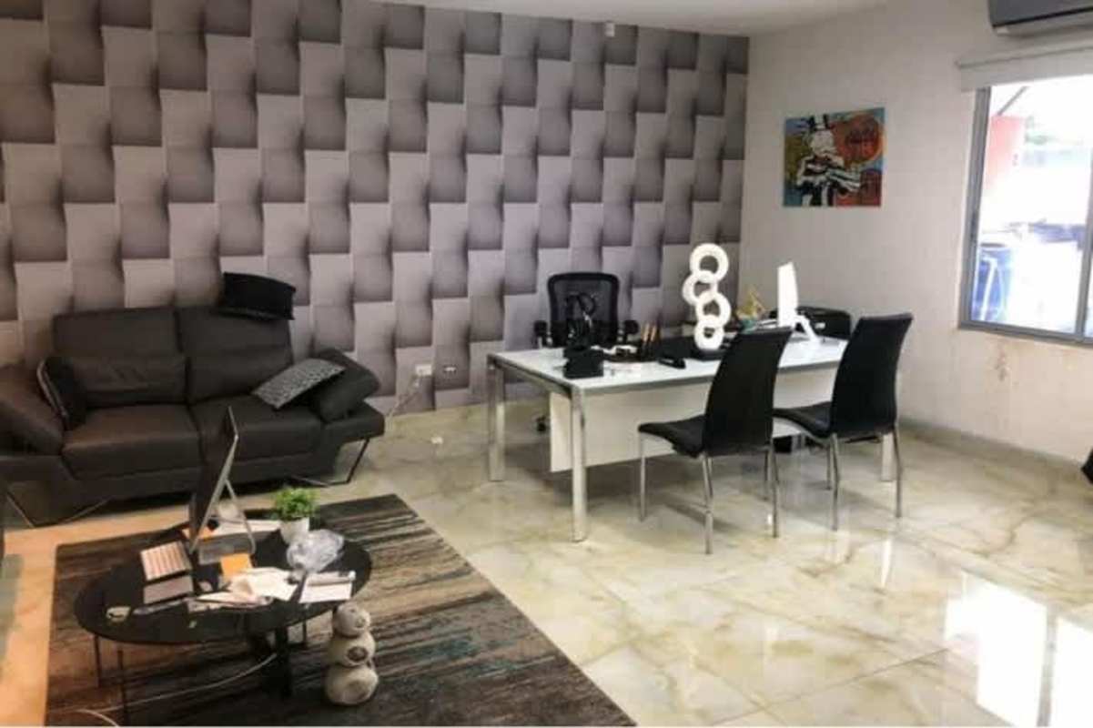 Modern corridor with glass walls, tiled floors, recessed ceiling lights Parque Industrial Costa del Este