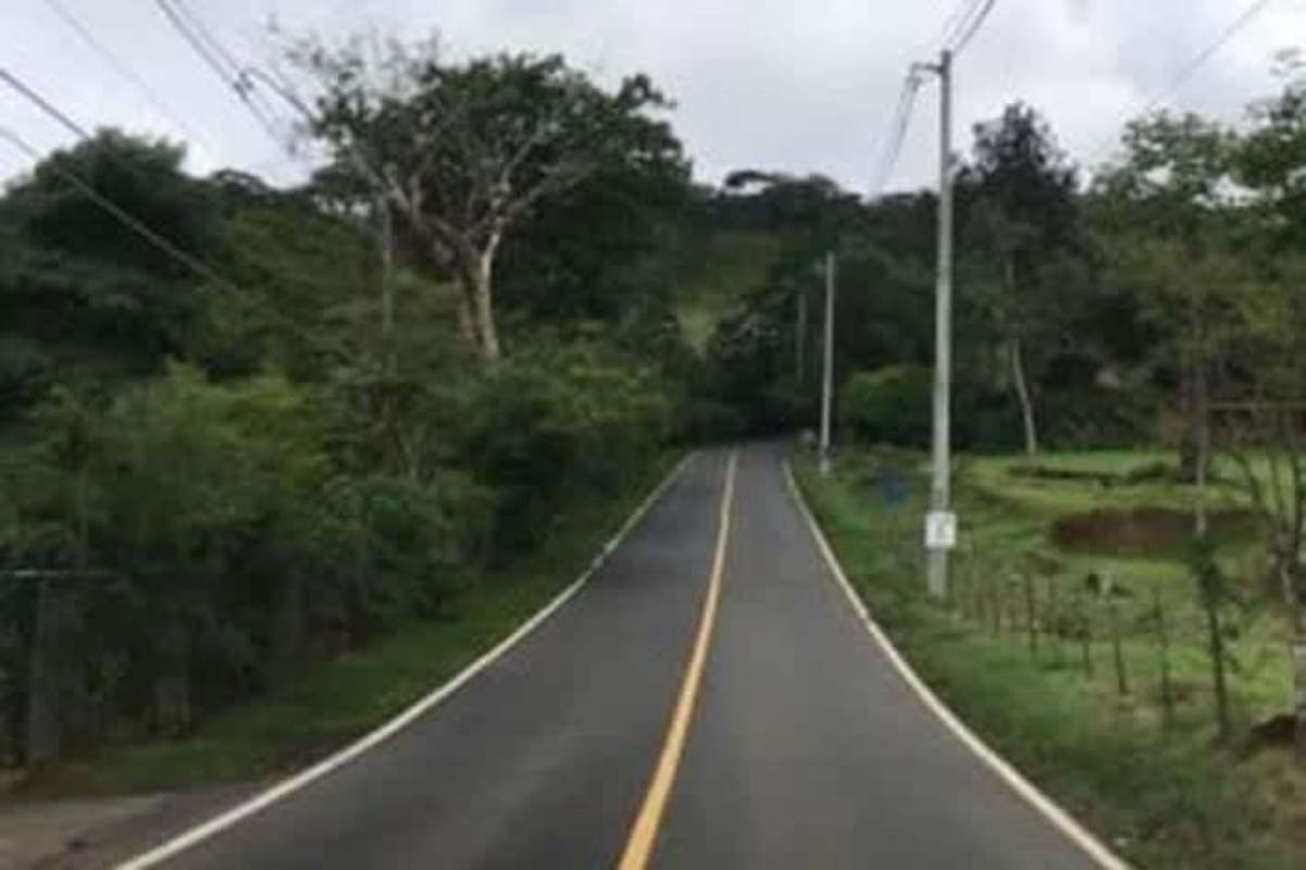 Panoramic mountain land covered in thick vegetation and misty skies in Cerro Azul Panama