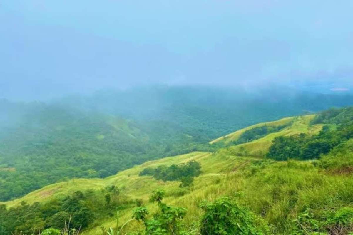 Fog-covered lush green hills and mountain terrain in Cerro Azul Panama ideal for eco-development