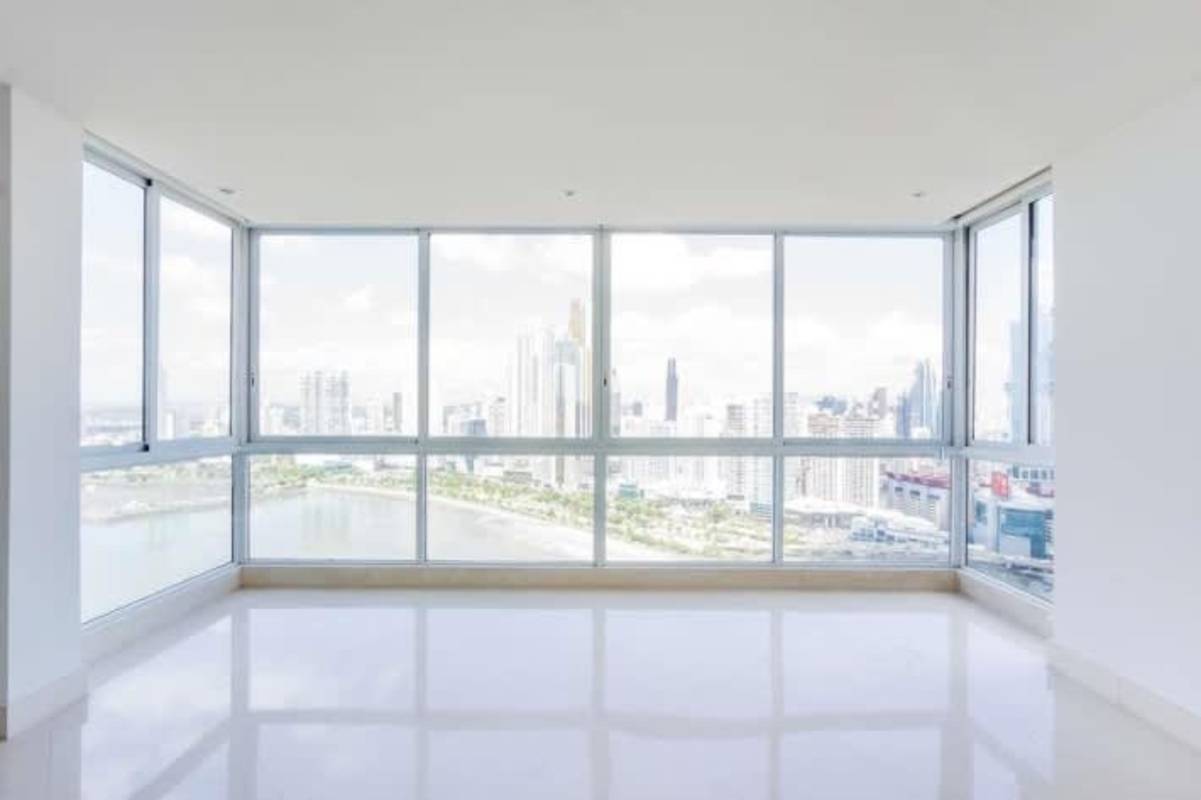 Living room corner windows panoramic skyline ocean views The Point Punta Paitilla