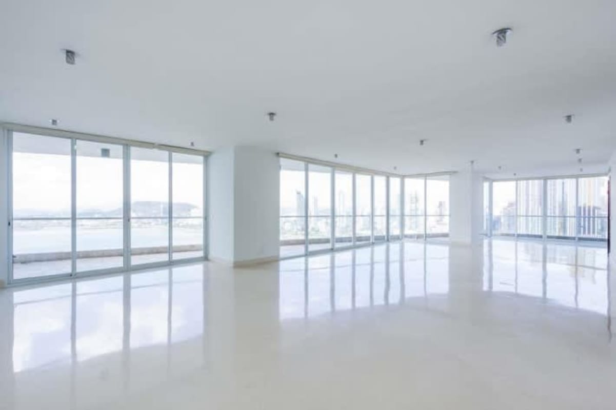 Bright panoramic living corner with city and Pacific views The Point Tower Panama