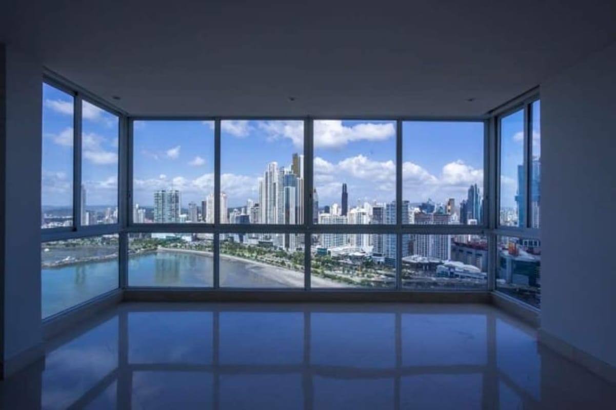 Contemporary kitchen with island granite countertops wood cabinets Punta Paitilla