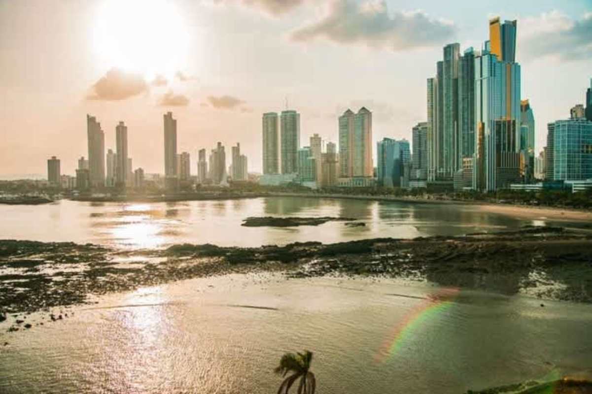 Luxury kitchen with granite countertops and island in The Point Panama City apartment