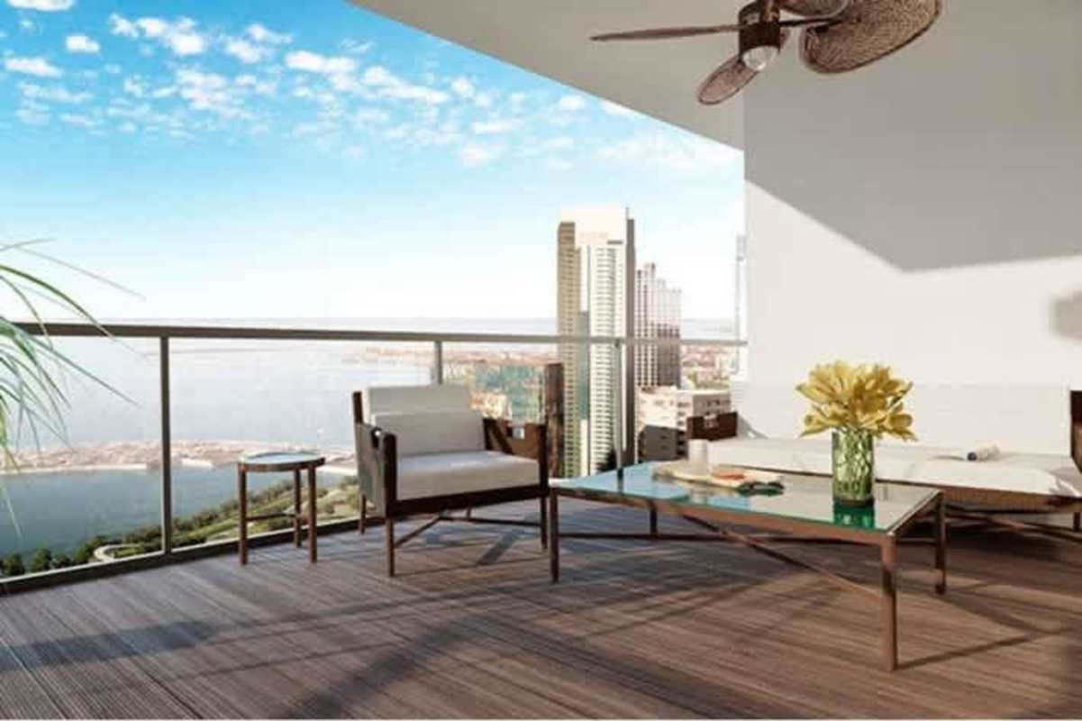 Modern glass facade of PH Costanera towers with balconies along Avenida Balboa