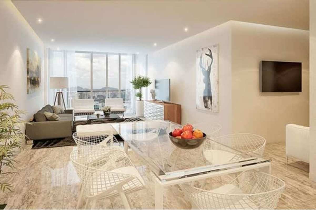 Contemporary living and dining area with floor-to-ceiling windows at PH Costanera Panama