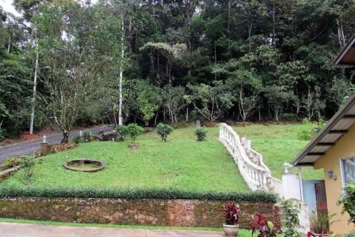 Kitchen area with wood cabinets, granite countertops and dining area Altos de Cerro Azul