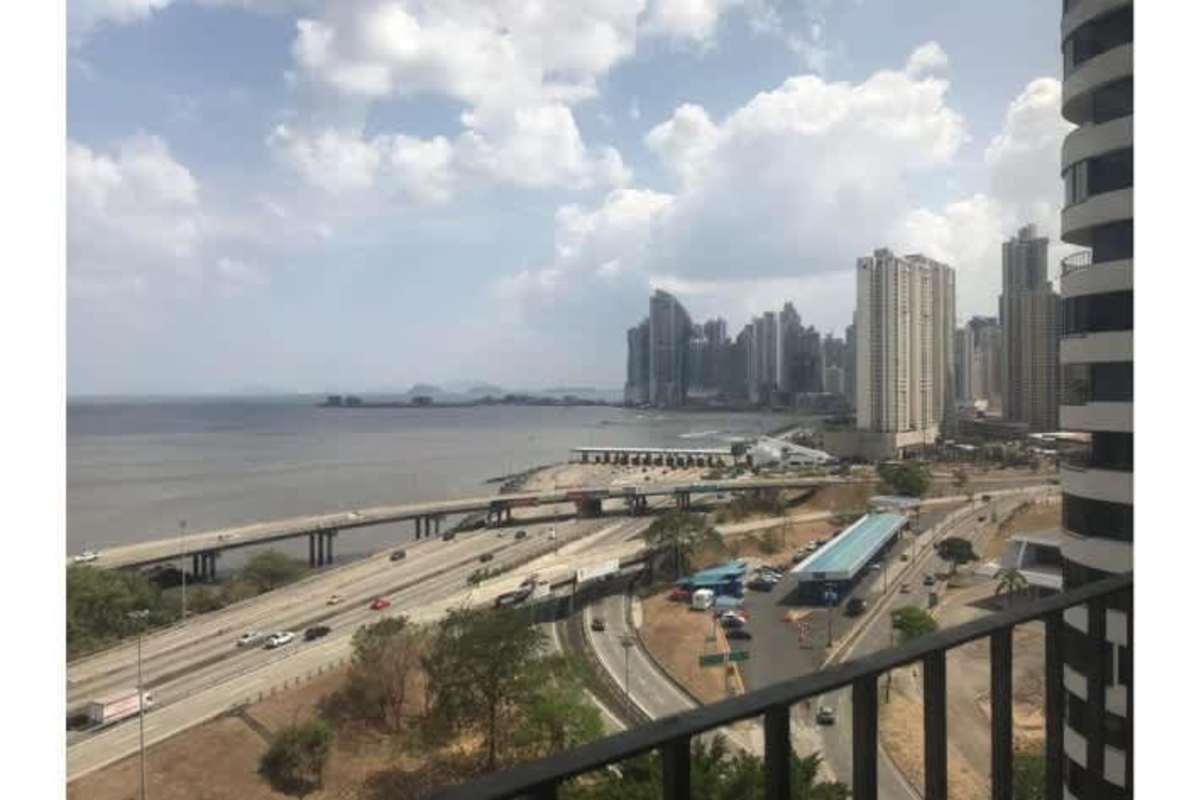 Aerial perspective of highway by coastline with skyline from PH Coco del Mar penthouse Panama