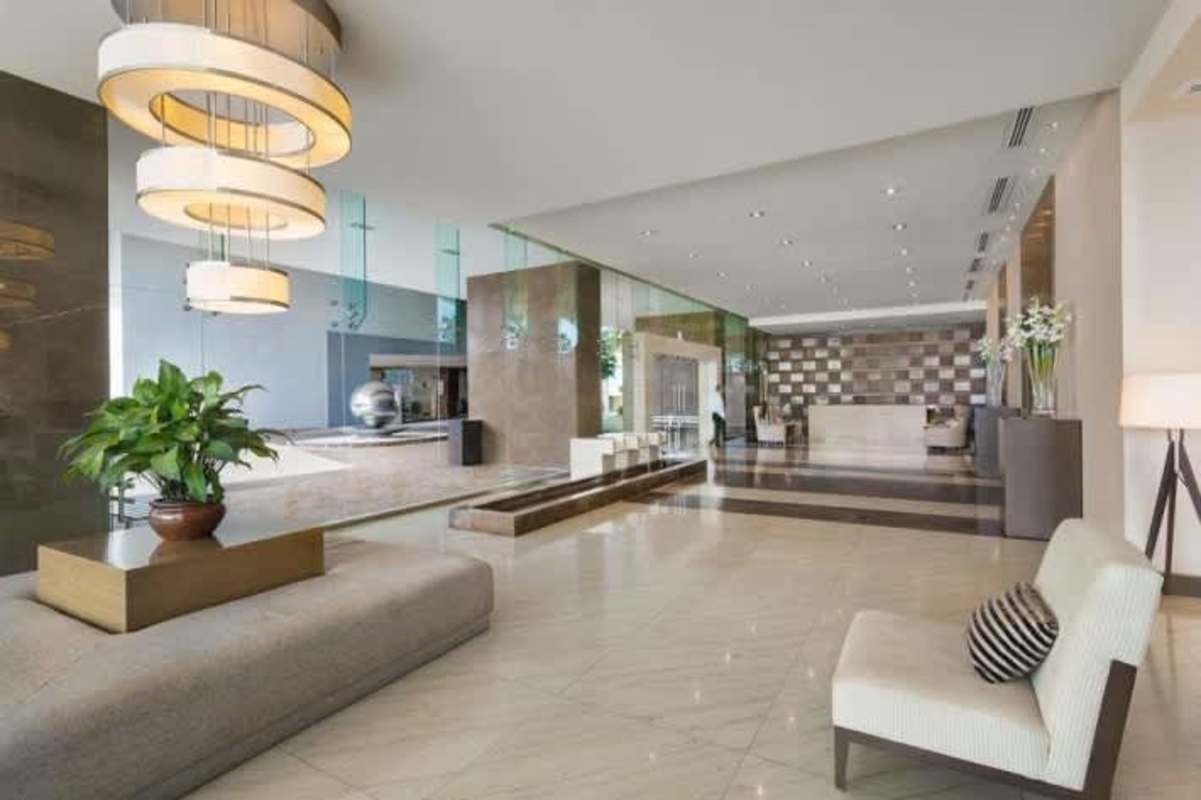 Contemporary marble lobby with concierge in The Point Punta Paitilla
