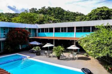 View of Pacific Coast Hotel signage, entrance canopy and balconies in Veracruz Panama Oeste