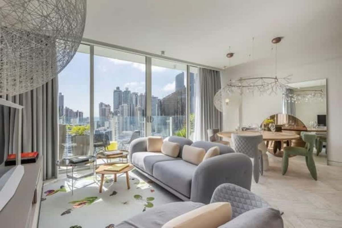 Spacious living-dining area with panoramic windows in Empire Residences Obarrio Panama