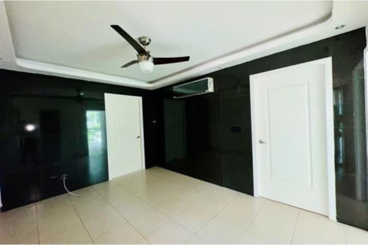 Granite kitchen island, stainless appliances and pendant lights in San Francisco Bay apartment Panama City