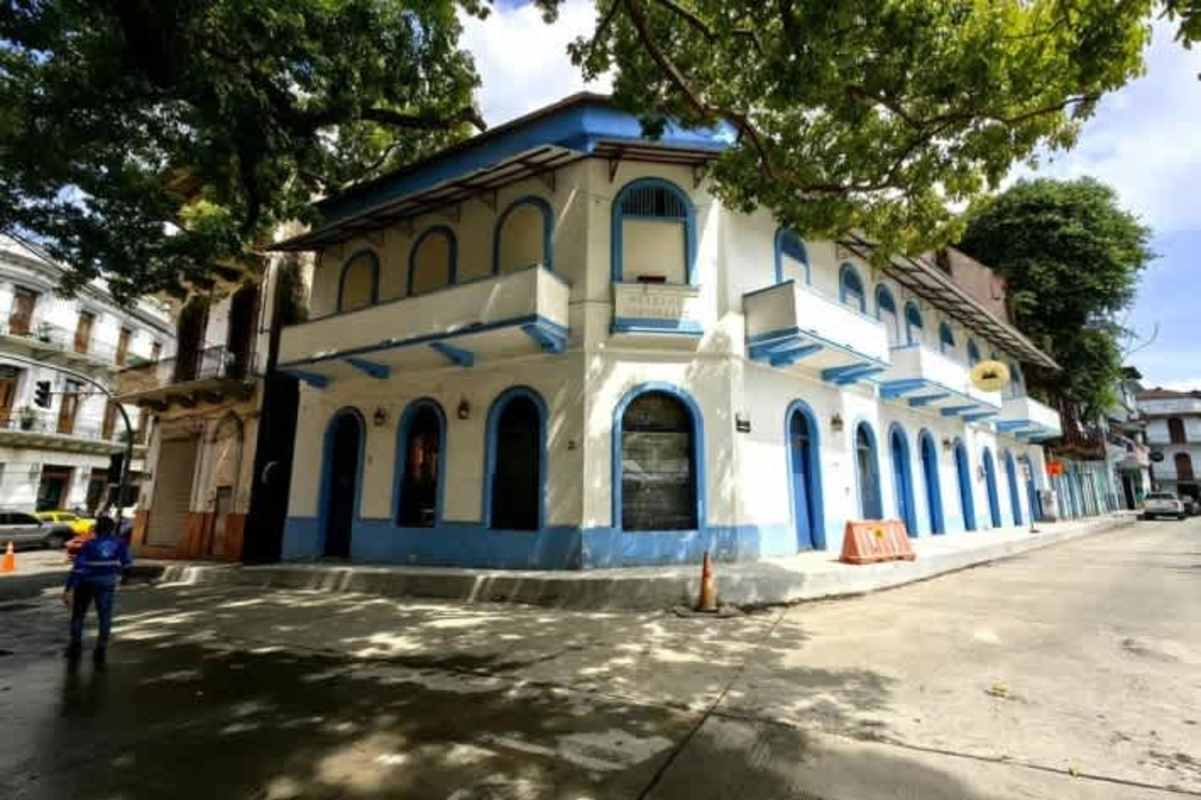 Historic commercial interior in Casco Viejo with arched windows and double-height ceilings Casa Natalia Panama