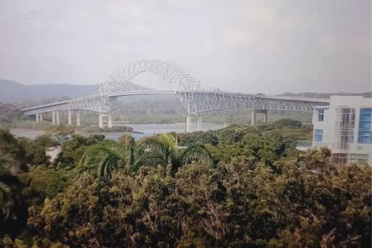 Iconic canal entrance view with Bridge of Americas from balcony at PH Amador Hills Panama