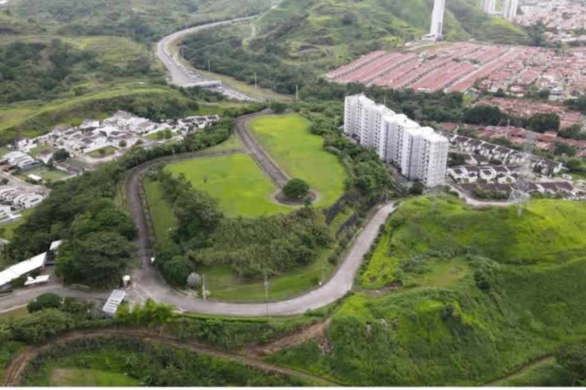 Aerial view highlighting future development land surrounded by residential buildings and green spaces in Panama City