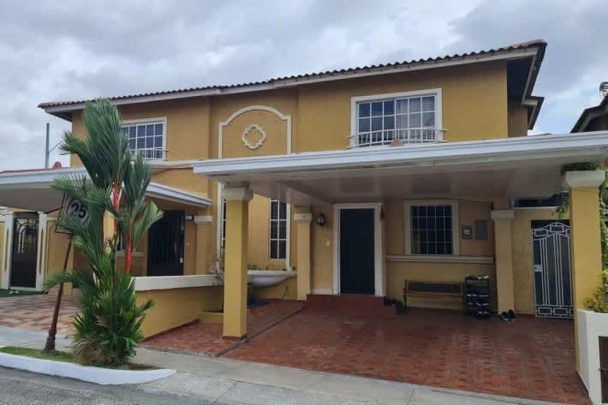 Living room with tiled flooring, large windows, and exercise equipment Dorado Lakes duplex Panama