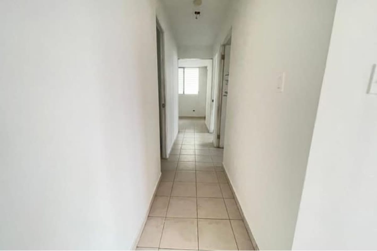 Bedroom with built-in closet, tile floor, window PH Residencial Río Abajo