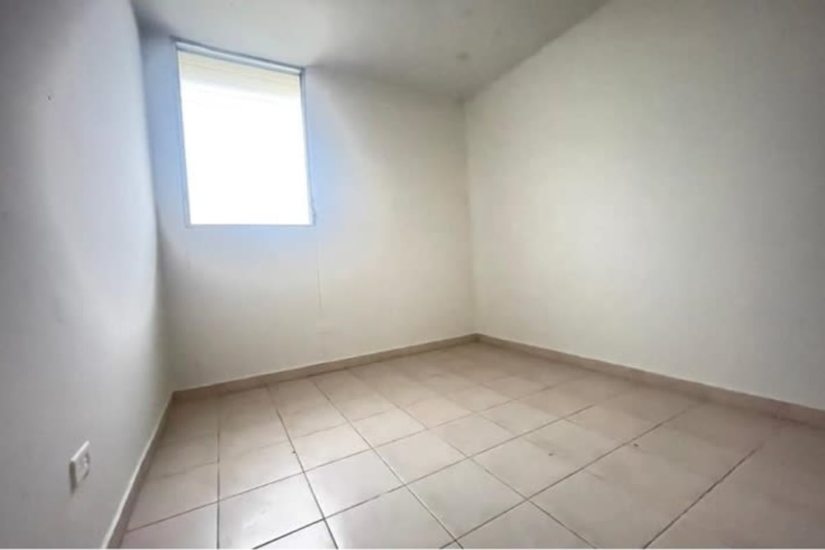 Simple bathroom tiled with pedestal sink and shower Panama apartment
