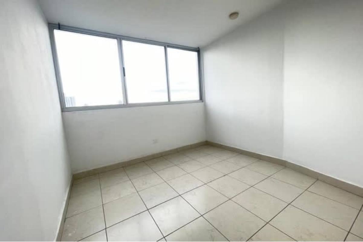 Bedroom with large window, tile floors and space for bed in PH Pueblo Nuevo Panama City