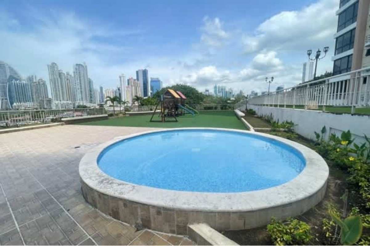 Outdoor pool deck with city skyline views PH Vía Romana Panama City