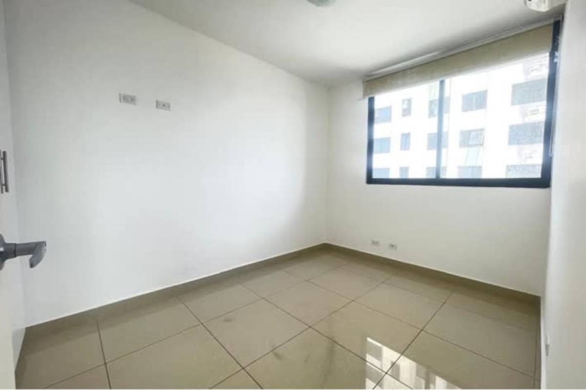 Minimalist bedroom with window and neutral walls PH Vía Romana Panama City