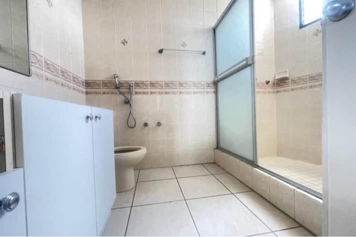 Modern kitchen with granite counters, dark cabinets in PH San Francisco Tower