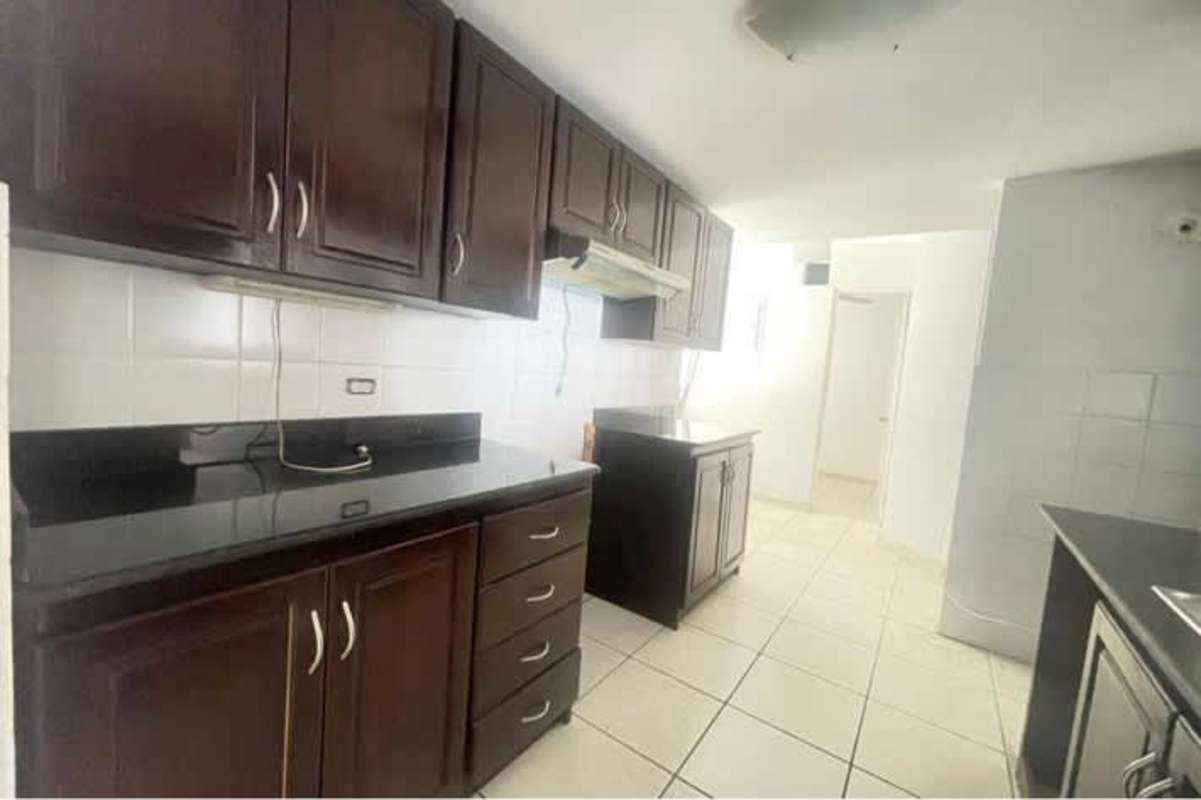 Kitchen with dark cabinets, granite countertops, tiled floor PH San Francisco Tower Panama