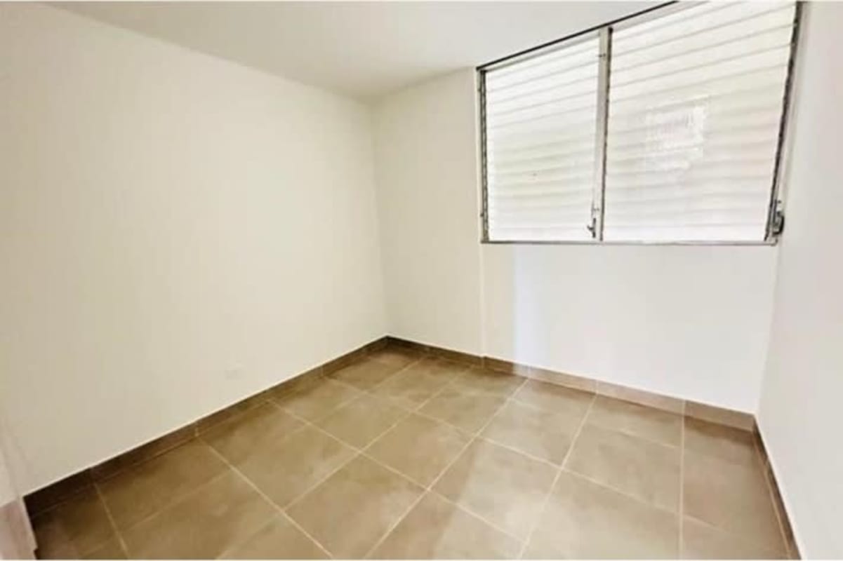 Simple bathroom with ceramic tiles, walk-in shower, pedestal sink in Panama City