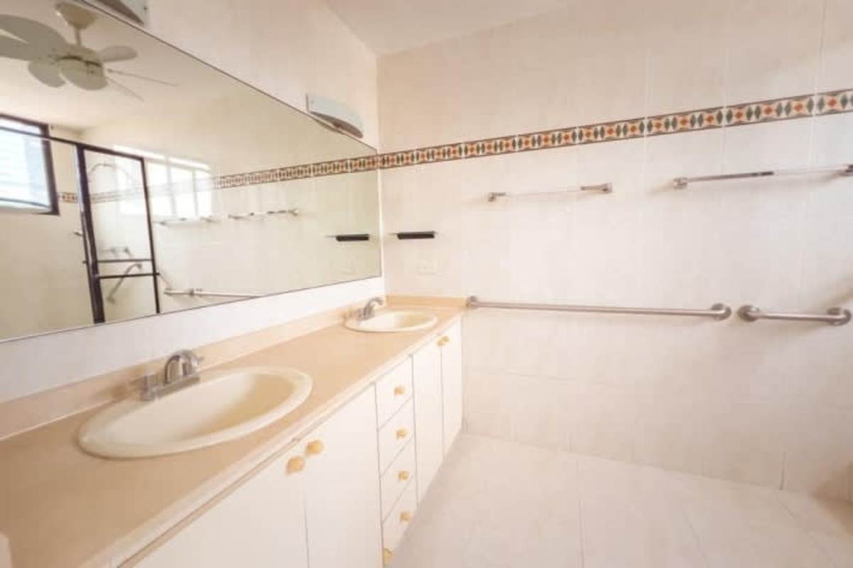 Bright bedroom with city view windows and AC Obarrio Panama City PH Park Loft