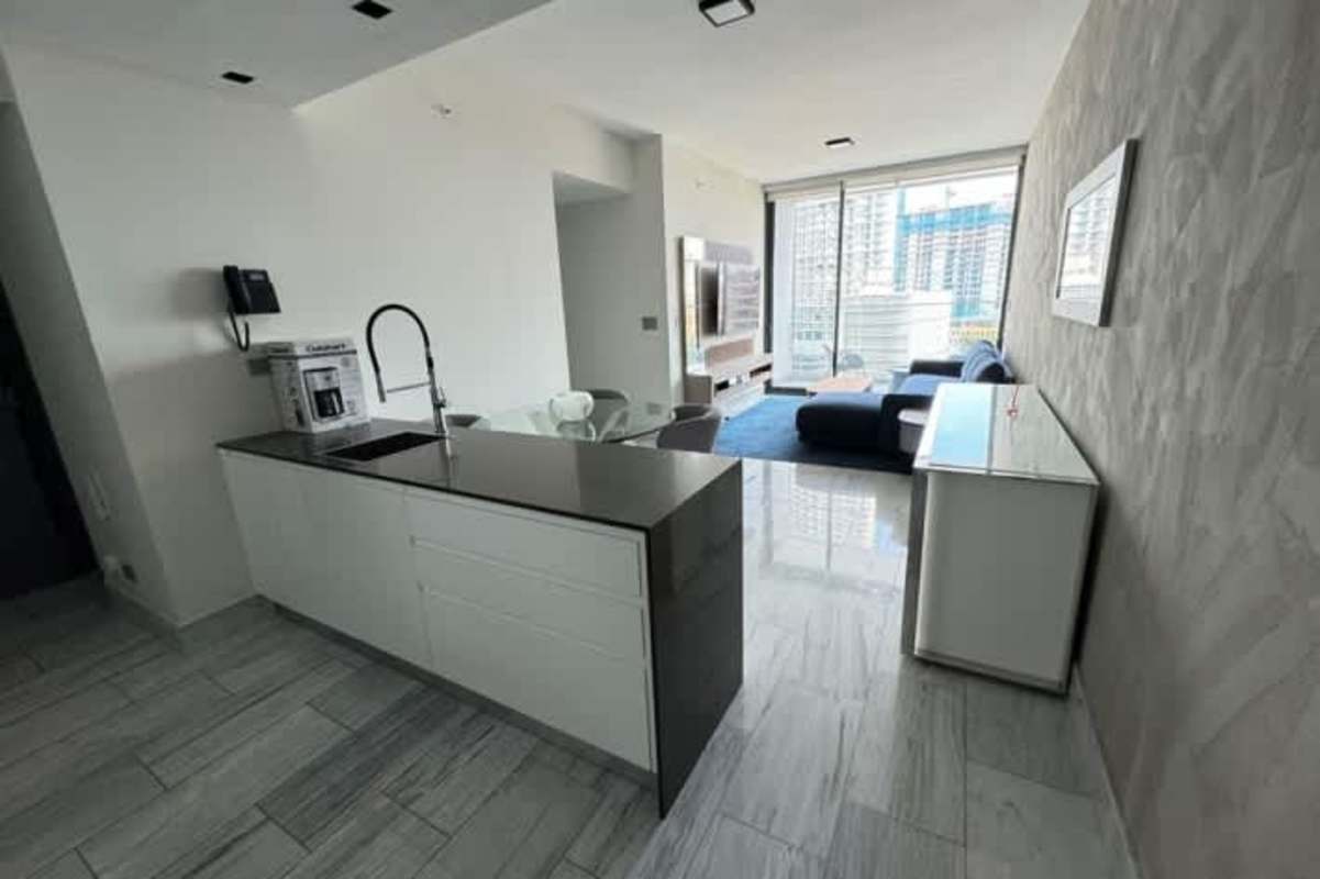 Modern bedroom with panoramic city view floor-to-ceiling windows Yoo Panama