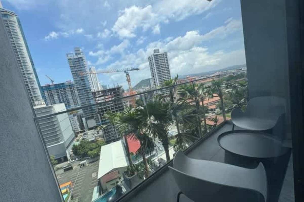 Balcony with outdoor furniture panoramic city and ocean views Yoo Panama Panama