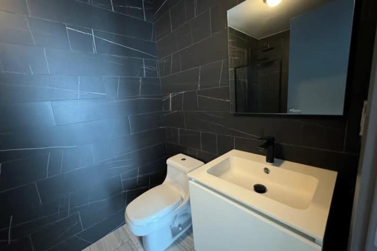 Contemporary kitchen island, appliances, marble backsplash luxury apartment PH BICSA Panama