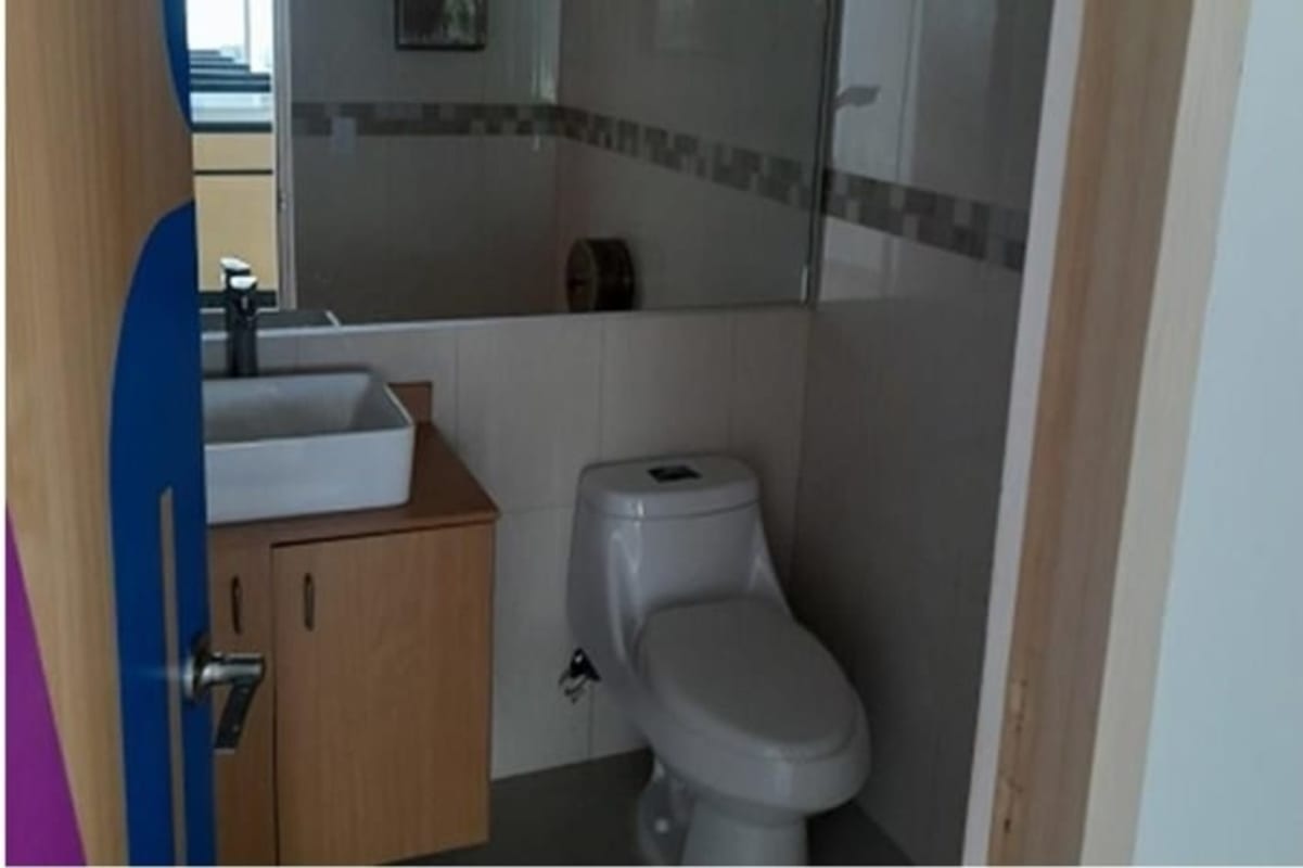 Compact modern bathroom inside commercial office Costa del Este Panama