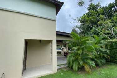 Bright open living room with tile floors and large windows in Panama Pacifico house