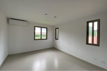 Shaded patio with view to mature landscaped backyard Panama Pacifico house