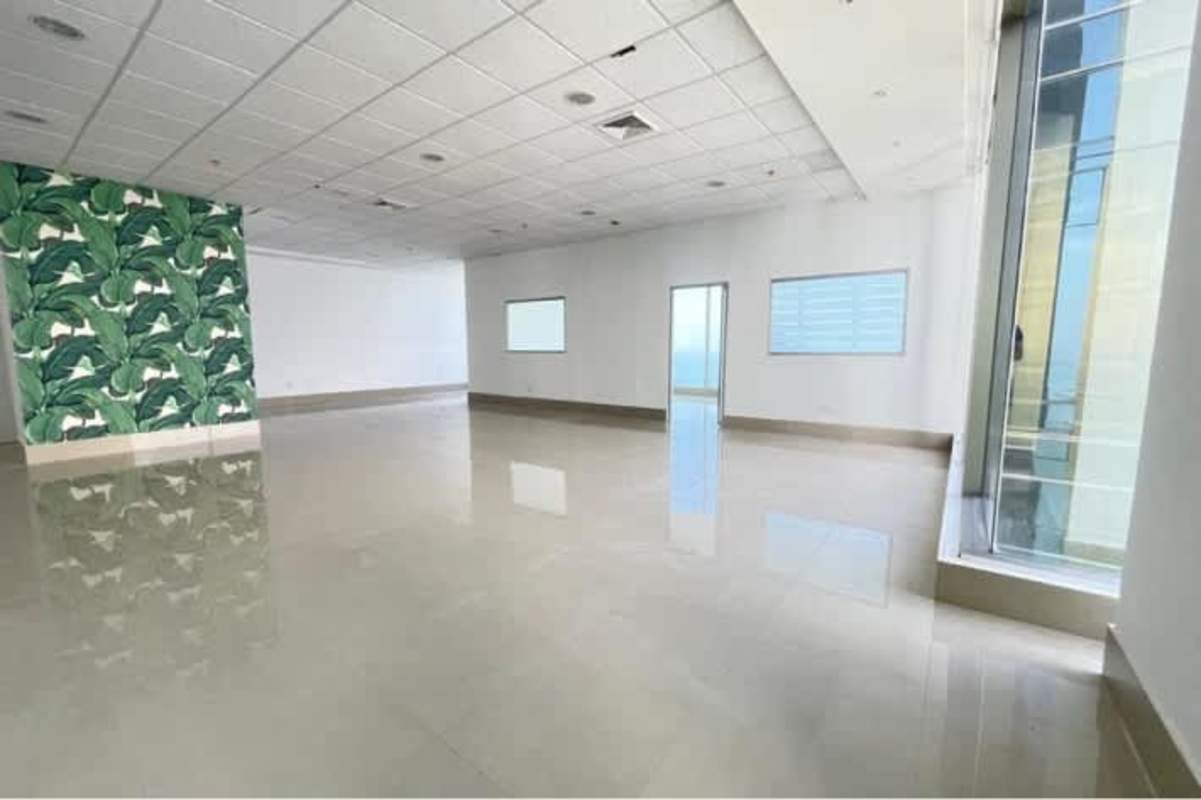 Spacious commercial office with large windows and tiled floors at PH BICSA Tower