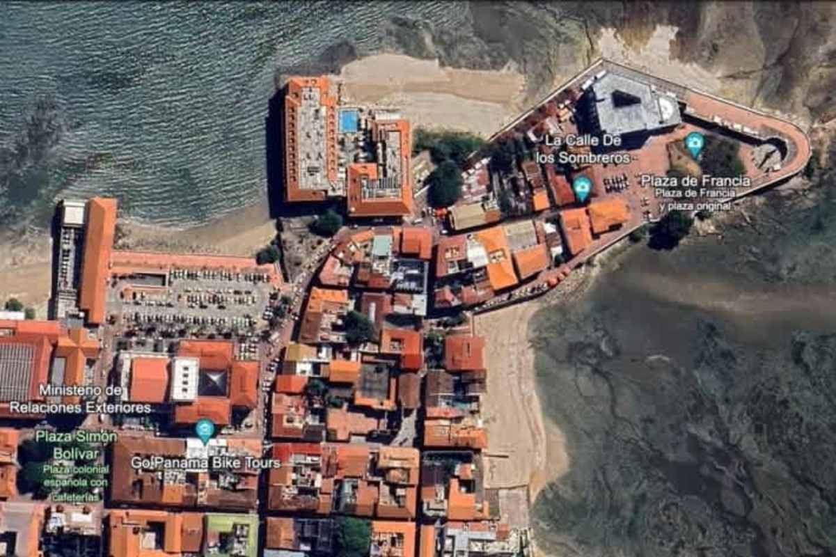 Aerial of historic Casco Viejo with coast, rooftops, Panama Bay skyline